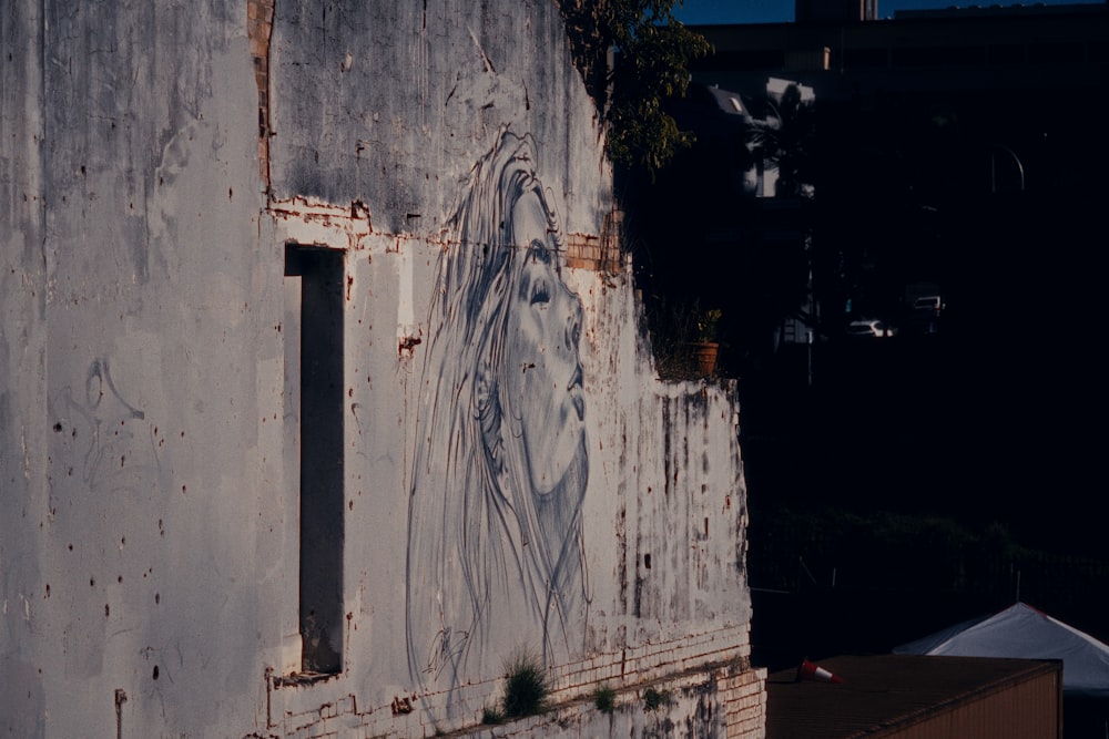 an old building with graffiti on the side of it