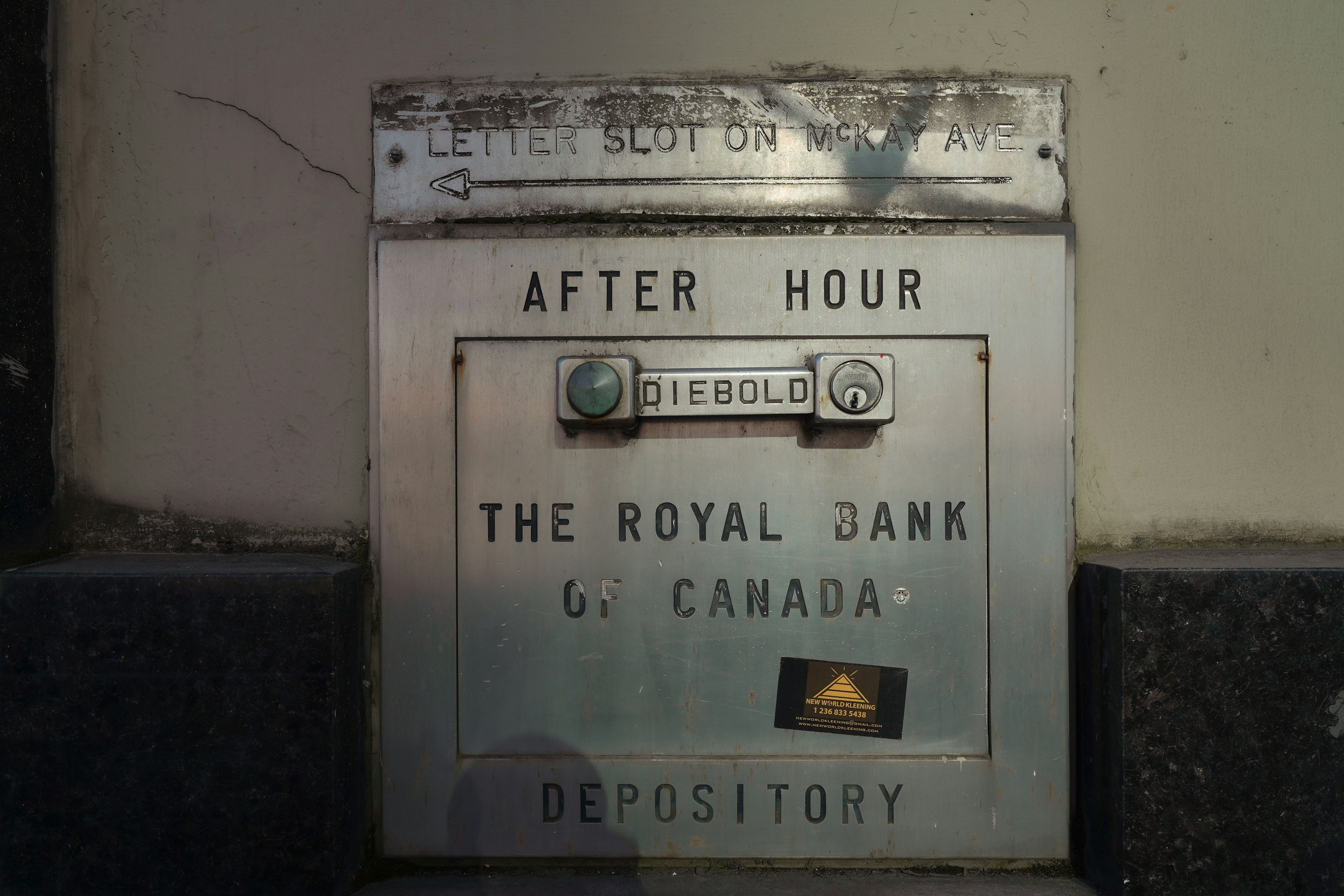 a sign on the side of a building that says after hour the royal bank of