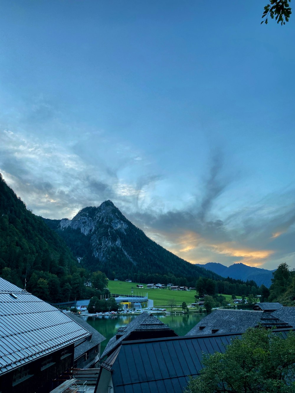 a view of a mountain range from a rooftop