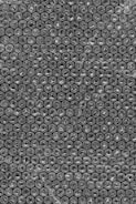 A close-up of bubble wrap rolls stacked neatly.
