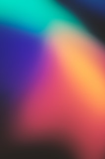 Abstract soft gradient blending deep teal and turquoise with hints of gold shimmer.