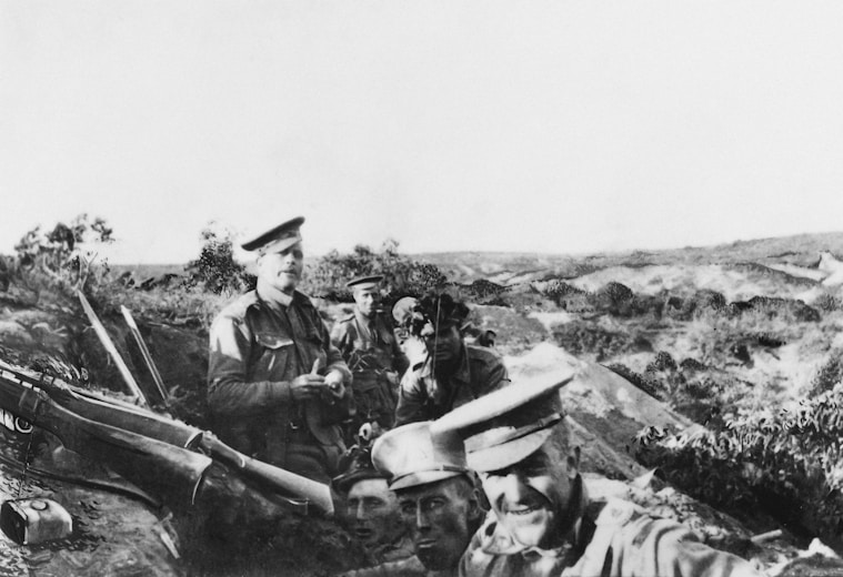 a black and white photo of a group of men with guns