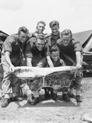 Young recruits preparing for military service with supportive community members