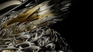 A complex, abstract digital artwork featuring swirling patterns and intricate details reminiscent of liquid metal. The image combines a mixture of gold, silver, and black hues, creating an almost three-dimensional appearance with reflective surfaces and smooth curves.