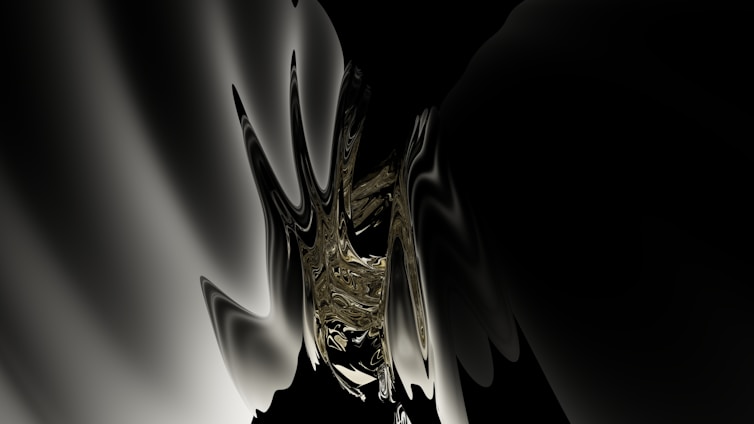 An elegant sculptural mural with deep black tones and warm gold accents.