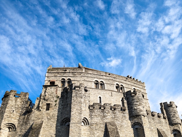 A historic castle standing majestically against a clear blue sky.