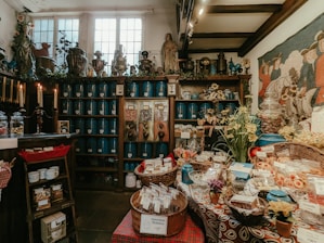 Cozy vintage shop interior with shelves filled with unique antique items and charming gift boxes.