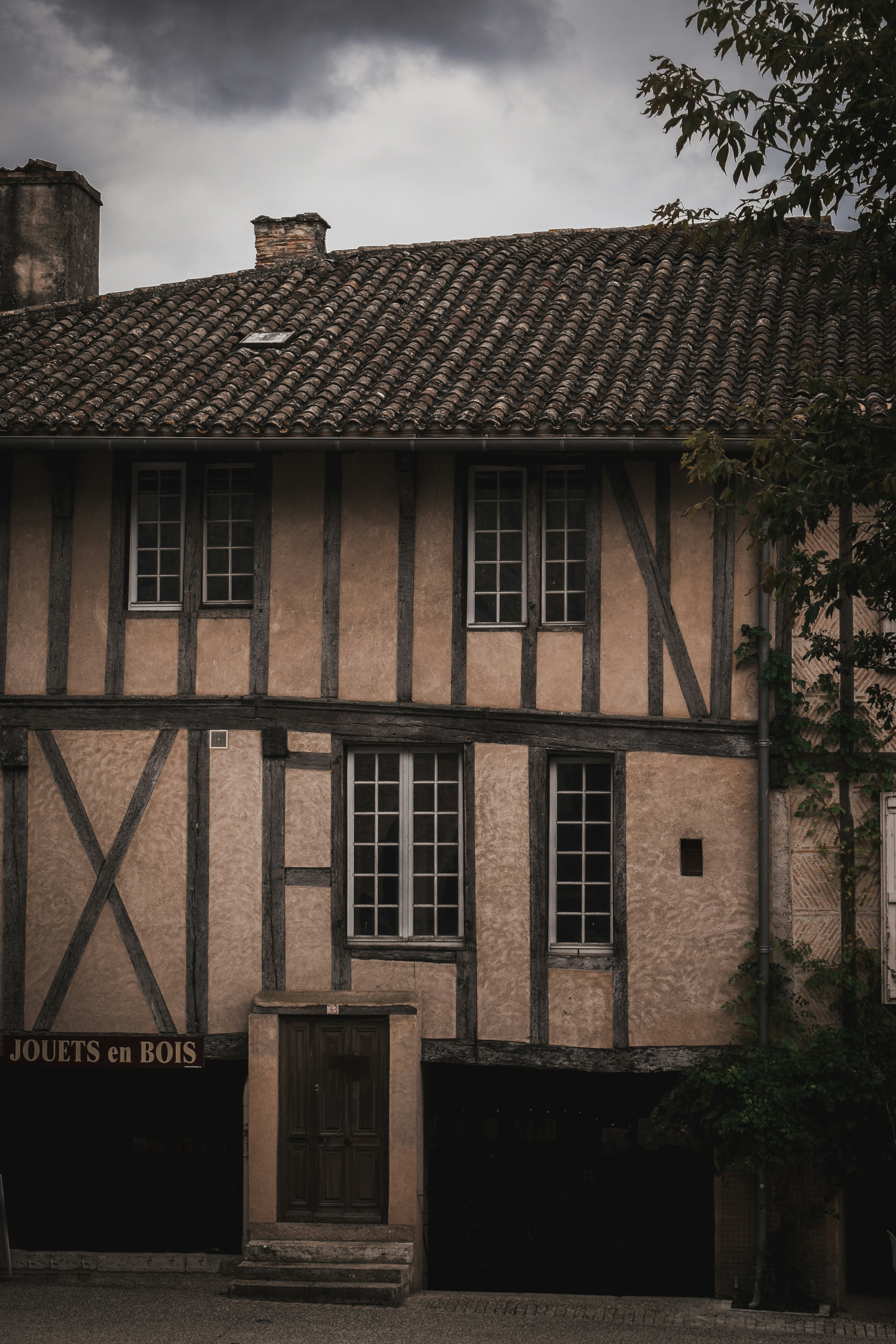 an old building with a clock on the front of it