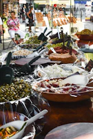 A vibrant display of seasonal Sicilian street food with fresh ingredients.