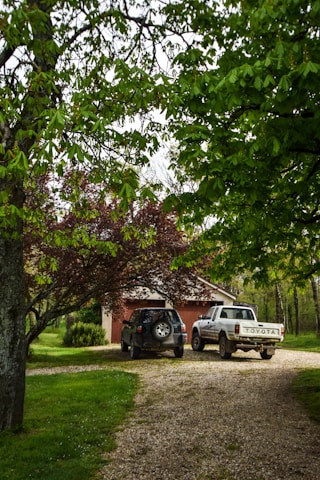 Before and after photos showing a lifted and leveled driveway in Inverness, Florida.