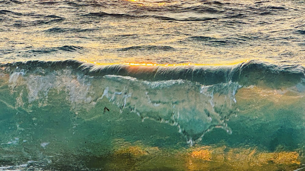 a large wave in the middle of the ocean