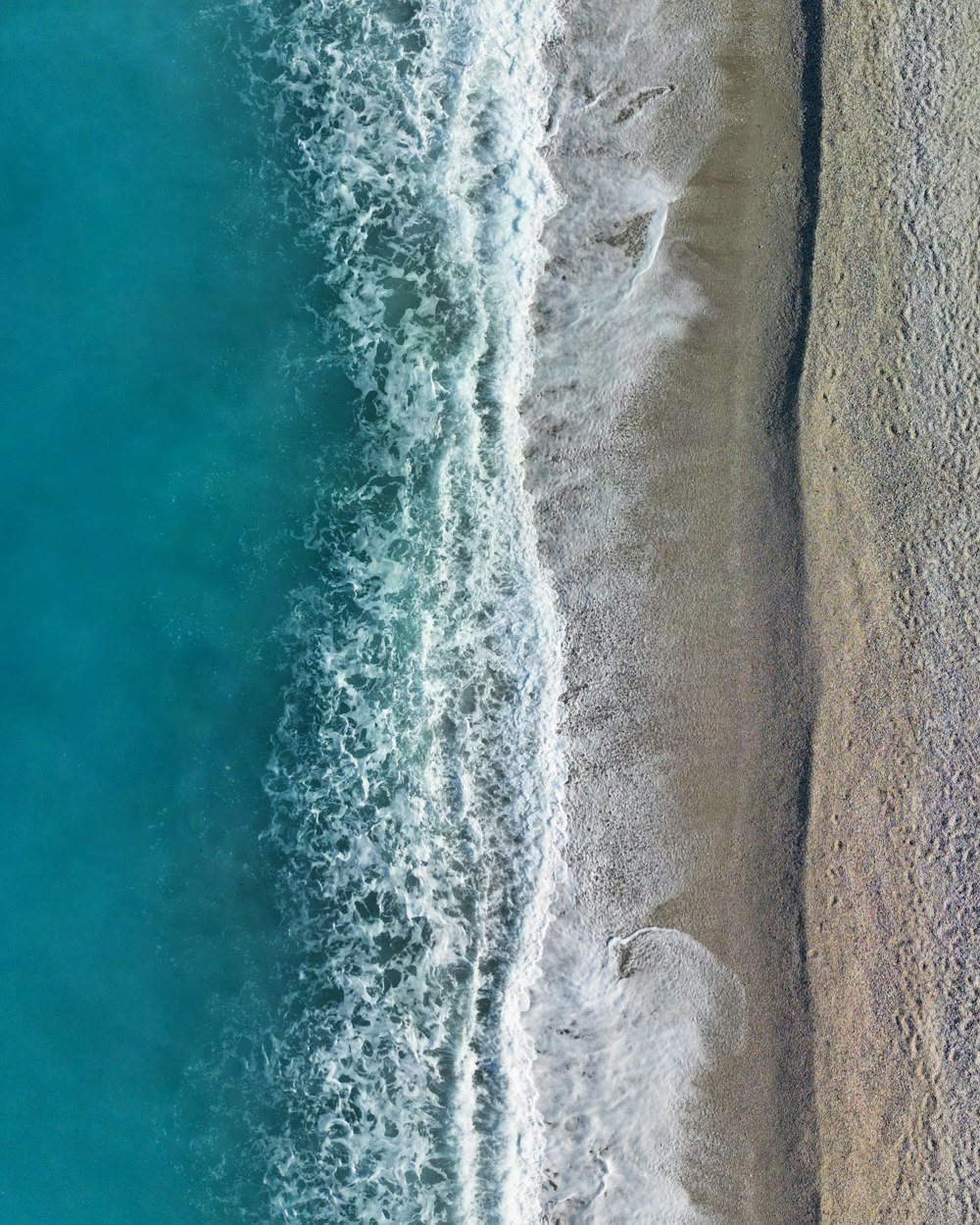 an aerial view of a beach and the ocean