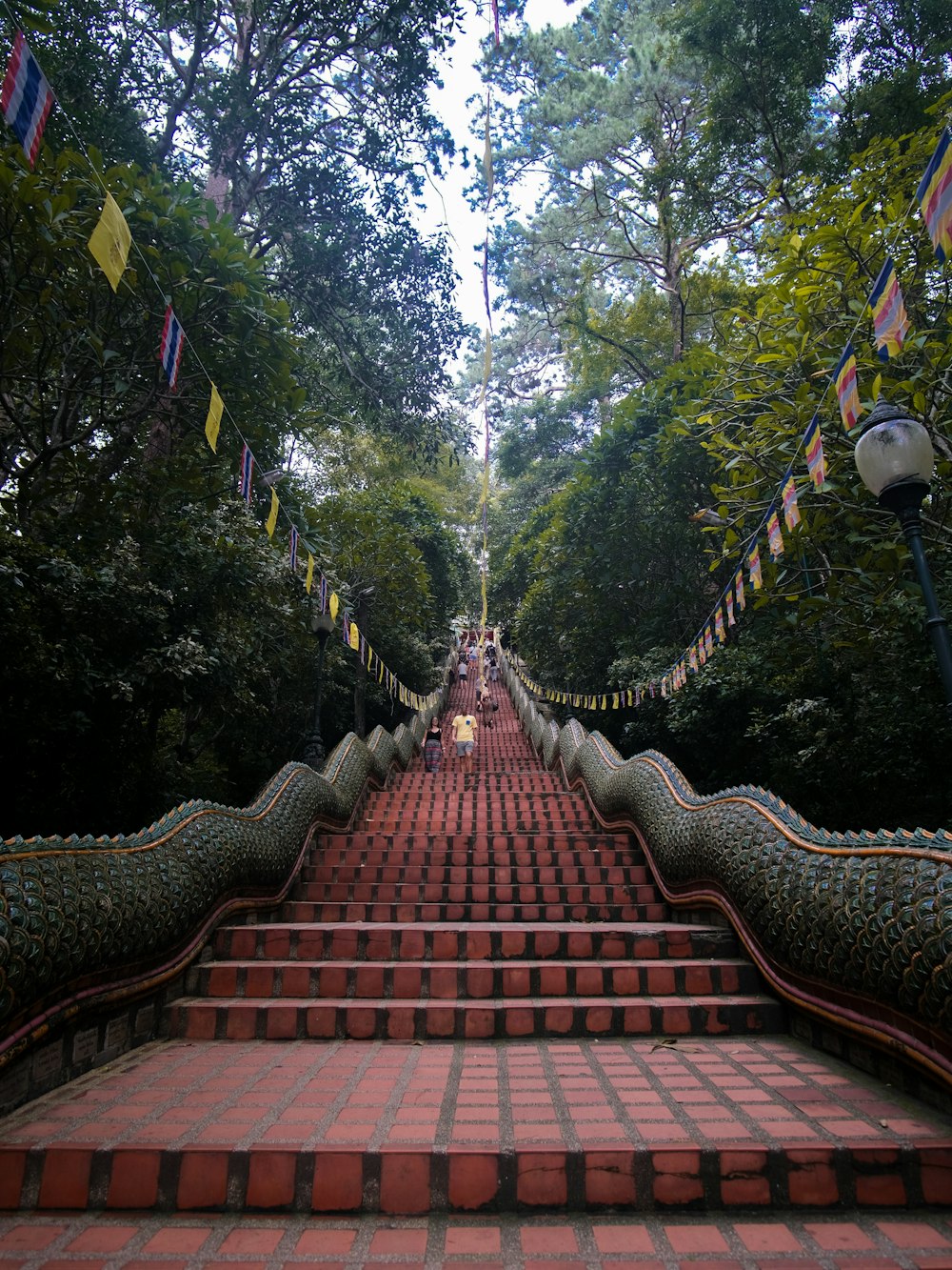 a long set of stairs with flags on each side