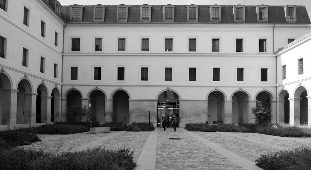 a black and white photo of a courtyard