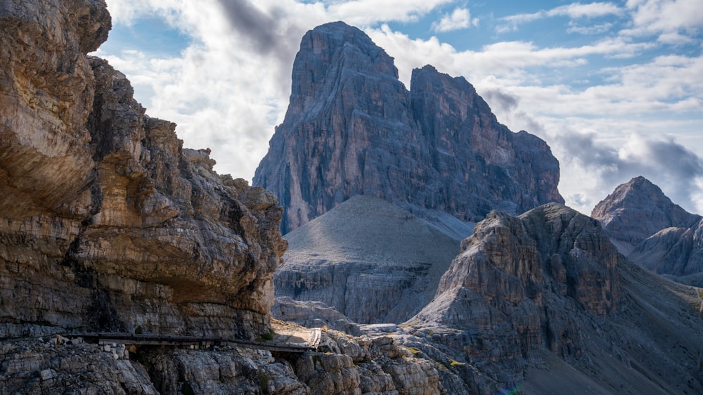 a view of a mountain range with a bridge in the foreground