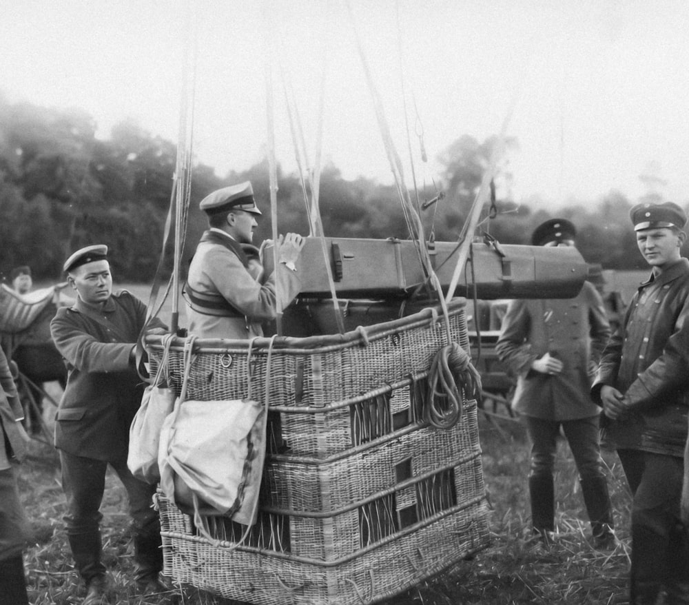 a group of men standing around a basket