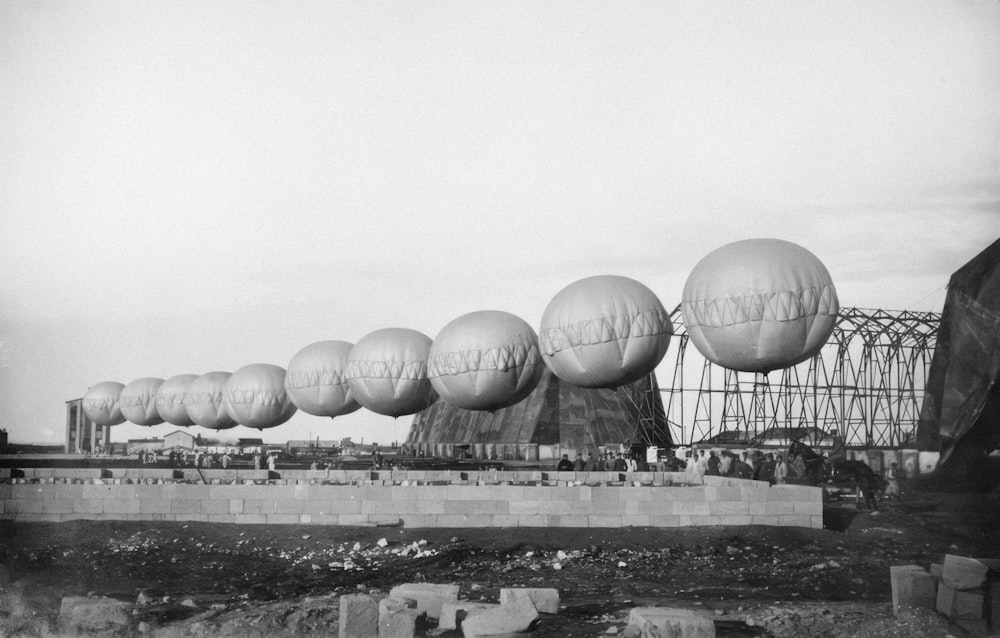 a black and white photo of a bunch of balloons