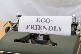 a close up of a typewriter with a paper that reads eco - friendly