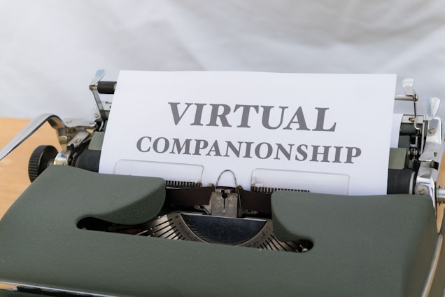 A typewriter holding a sheet of paper with the text 'VIRTUAL COMPANIONSHIP' typed on it. The scene captures the nostalgia of a traditional typing machine with a modern concept printed.