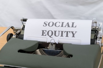 a close up of a typewriter with a paper on it