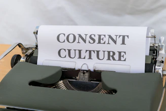 a close up of a typewriter with a paper on it