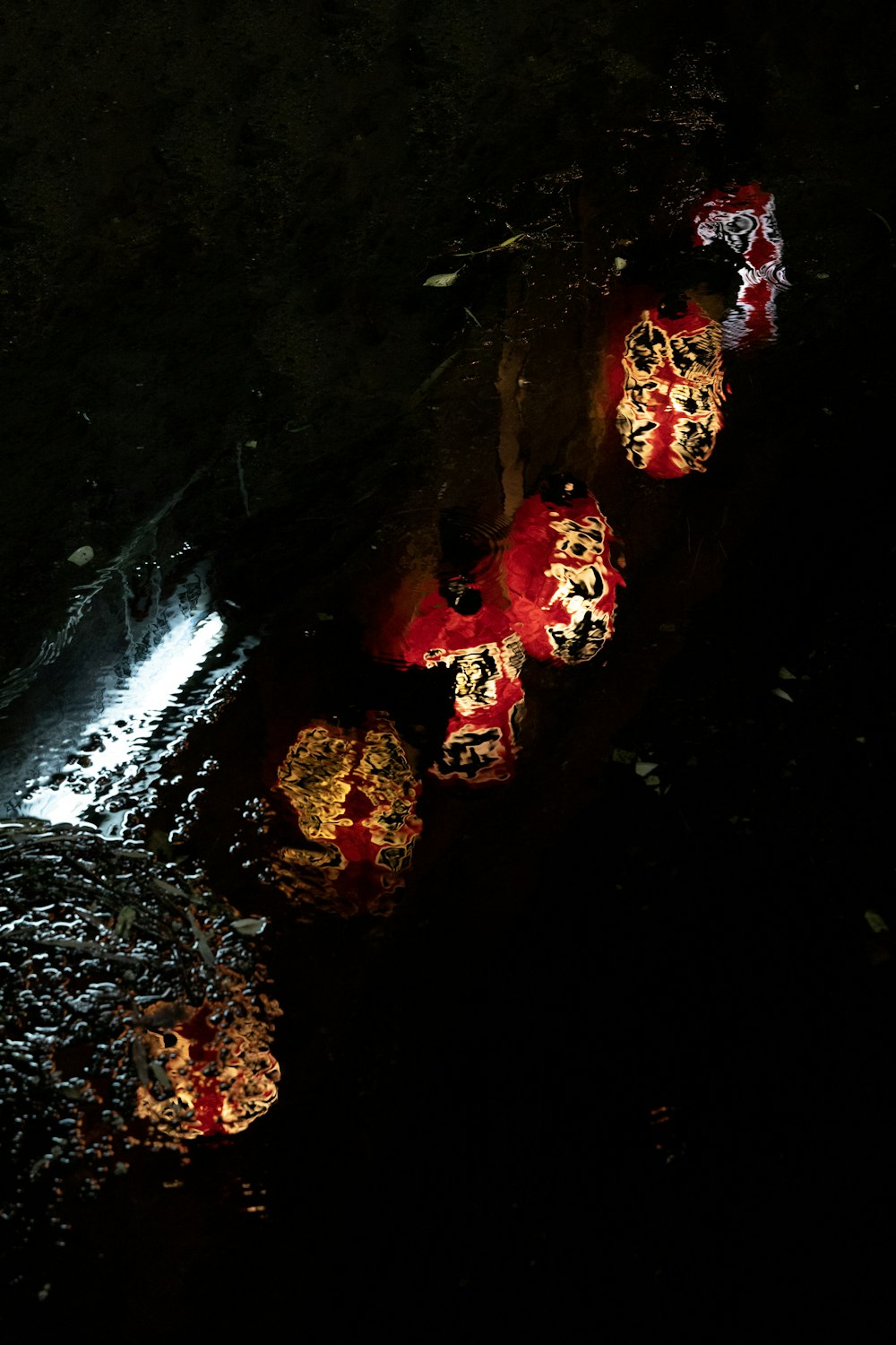 a group of umbrellas that are sitting in the dark