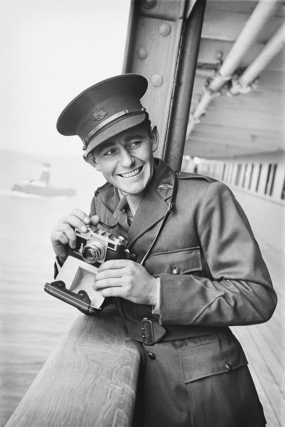 a black and white photo of a man in uniform