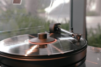a turntable with a record player sitting on top of it