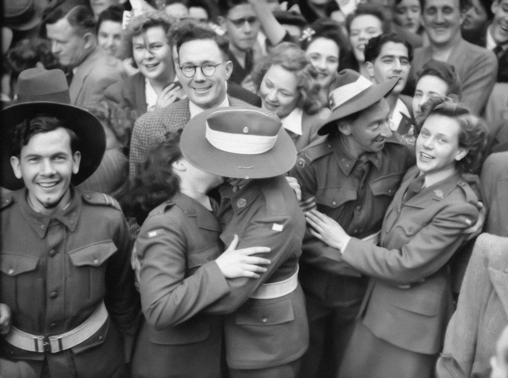 a group of people in uniform are hugging each other