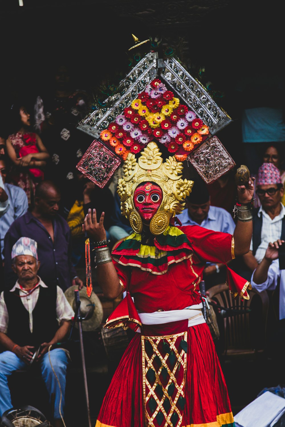 a woman dressed in a red and yellow costume