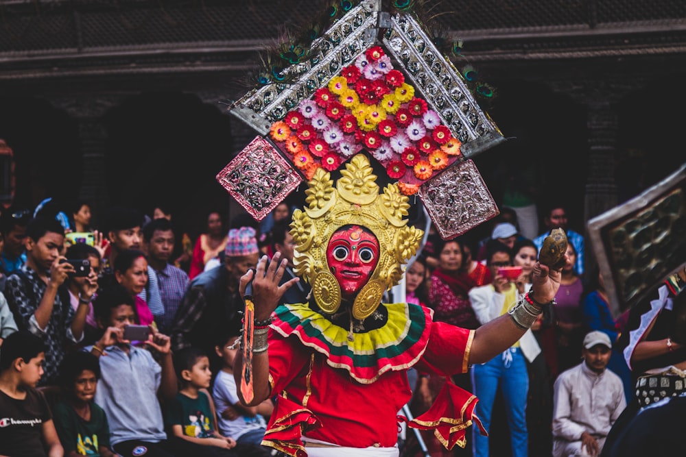 a person in a costume with a large headpiece