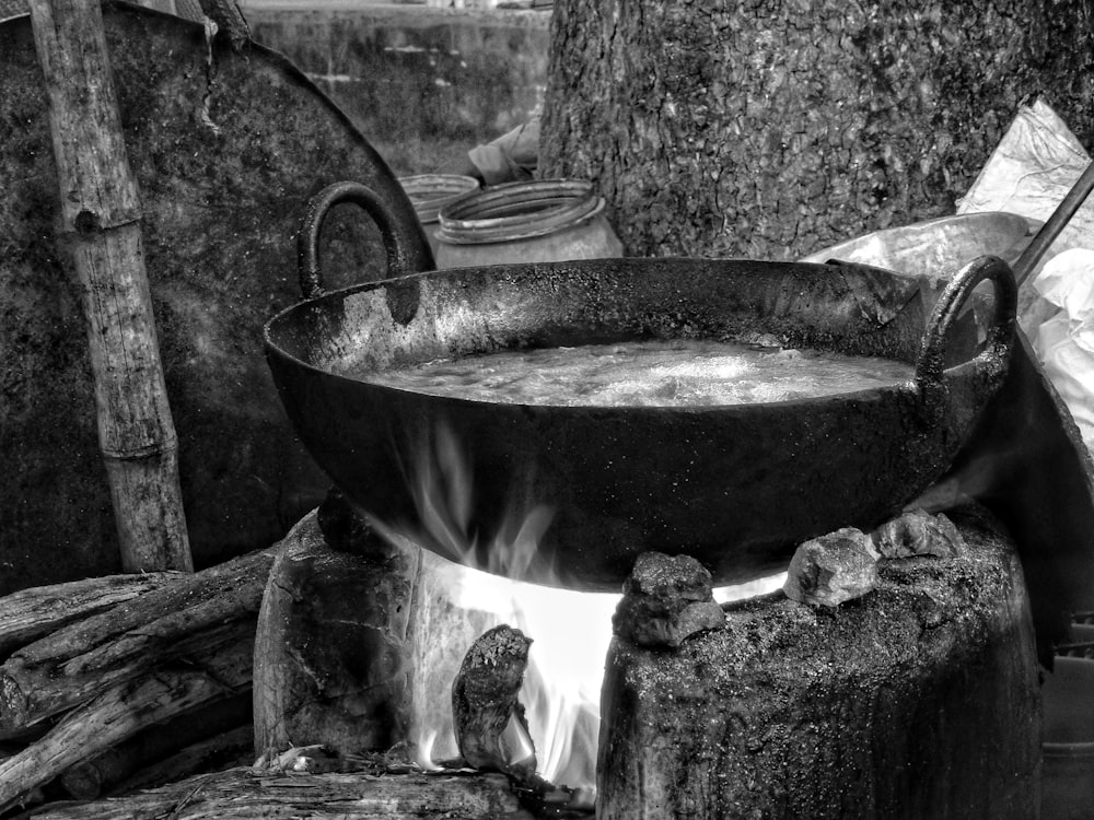 a large metal bowl sitting on top of a fire pit