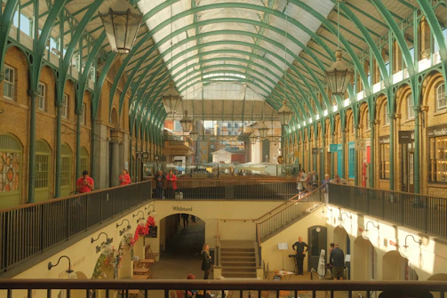 Interior shot showing vibrant shops and shoppers inside Plaza Caguán.