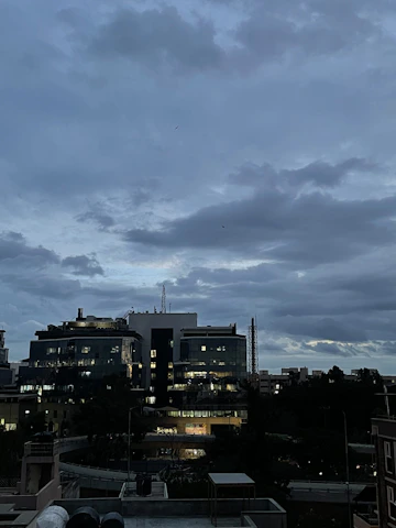 A sleek, modern office skyline at dusk symbolizing global business connections and growth.