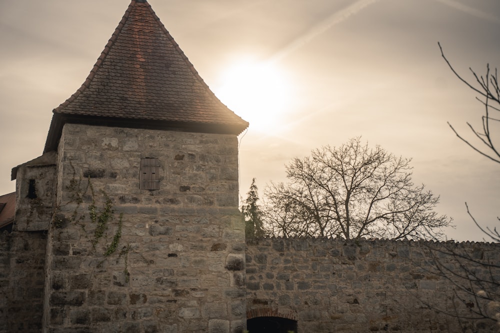 a stone building with a steeple on top of it