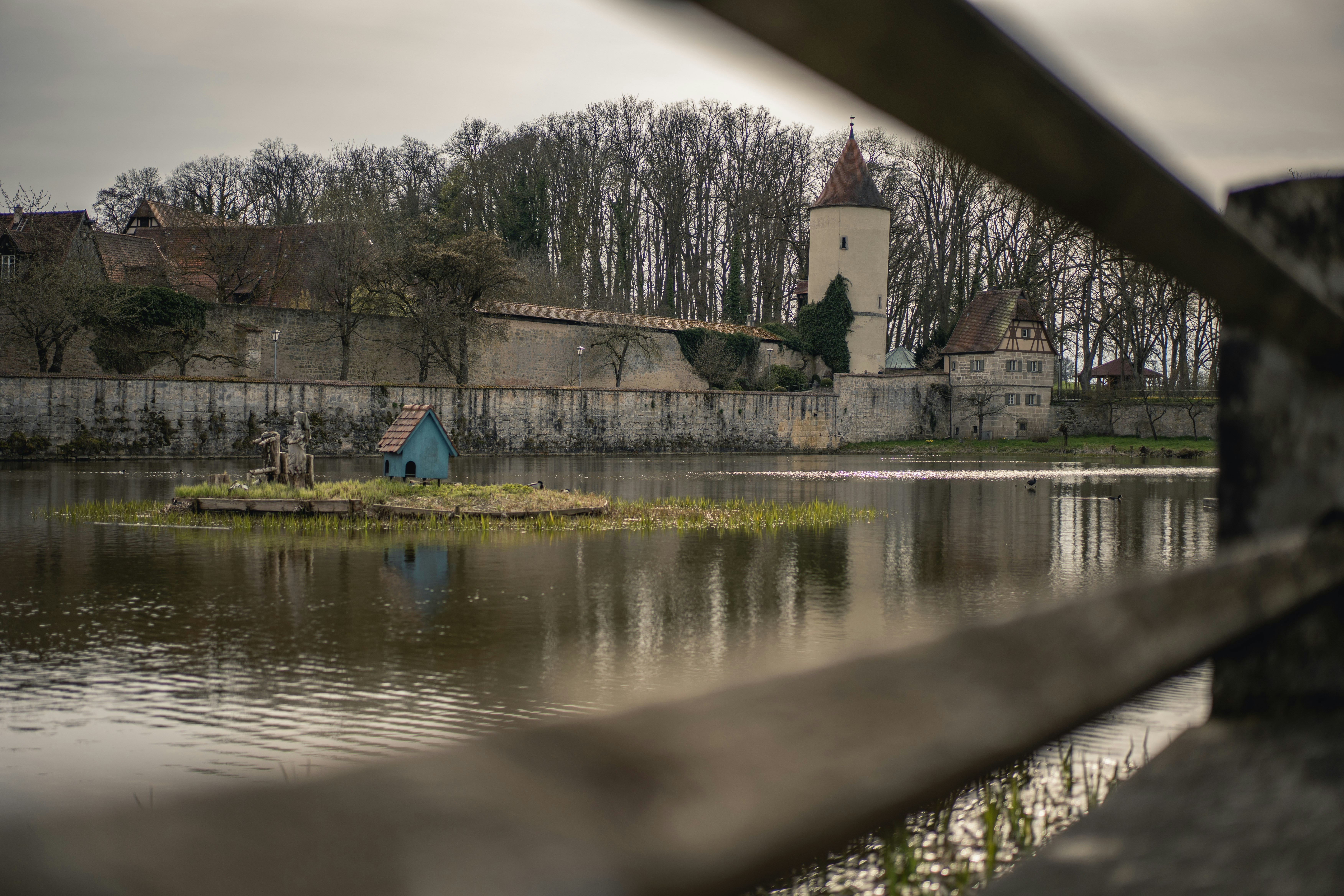 a lake with a building in the background