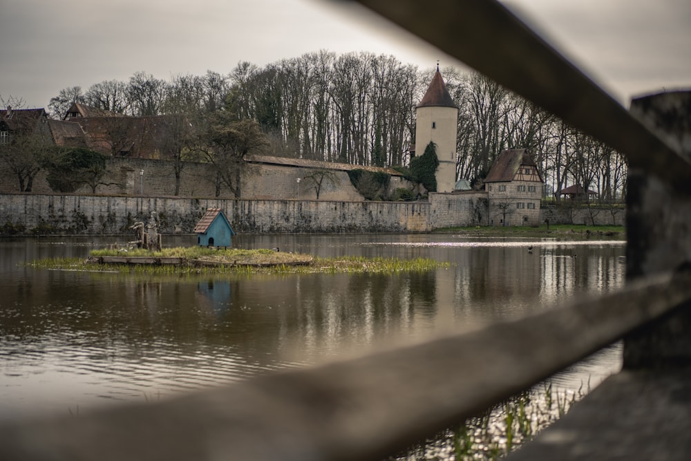 a lake with a building in the background