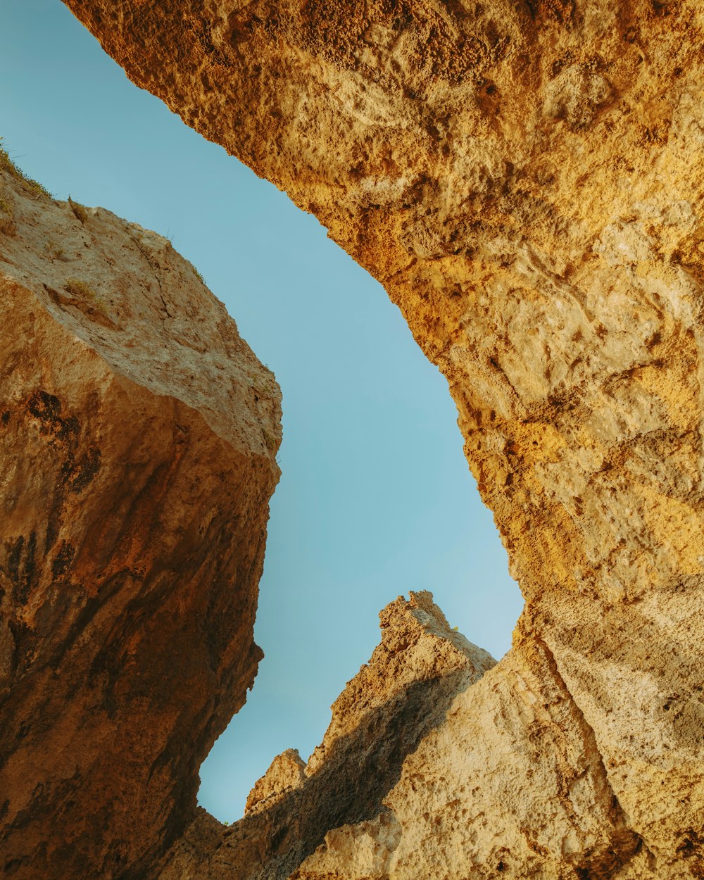 a rock formation with a sky in the background