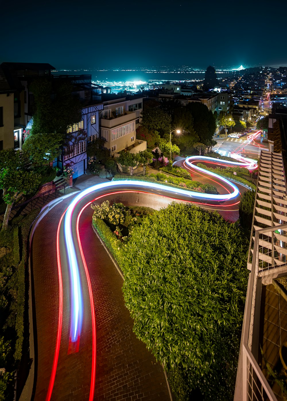 a long exposure photo of a city street at night