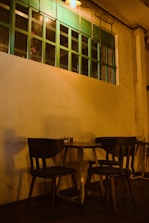 A cozy café interior with comfortable seating and warm lighting.