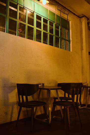 A cozy coffee shop setting with warm lighting.