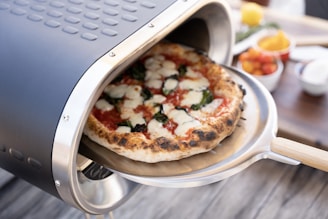 a pizza sitting on top of a pizza pan