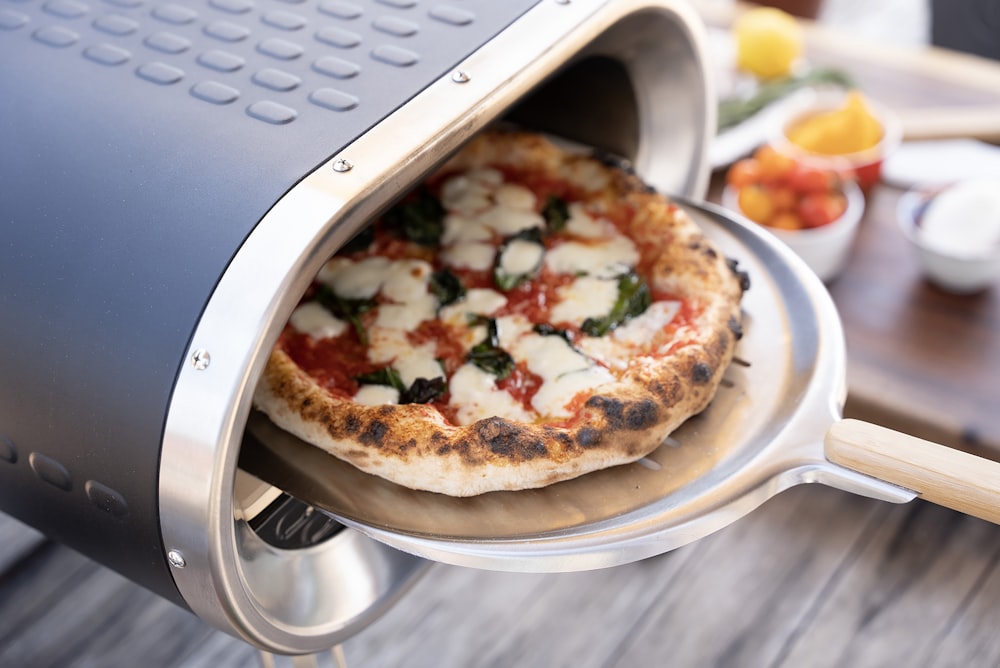 a pizza sitting on top of a pizza pan