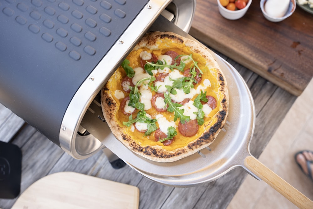 a pizza sitting on top of a pizza pan