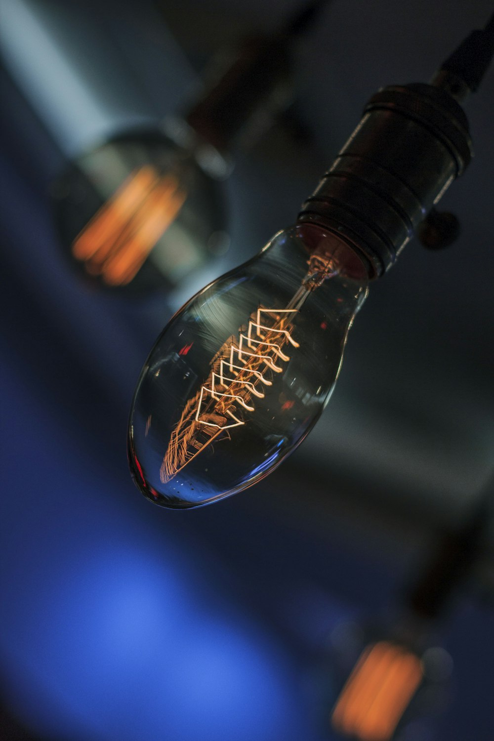 a close up of a light bulb with a blue background