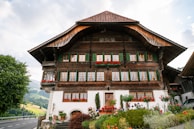 Exterior of a recently painted chalet showcasing smooth, vibrant facade colors.