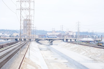 Rendering of a modern drainage system including canals and galleries in an industrial area.