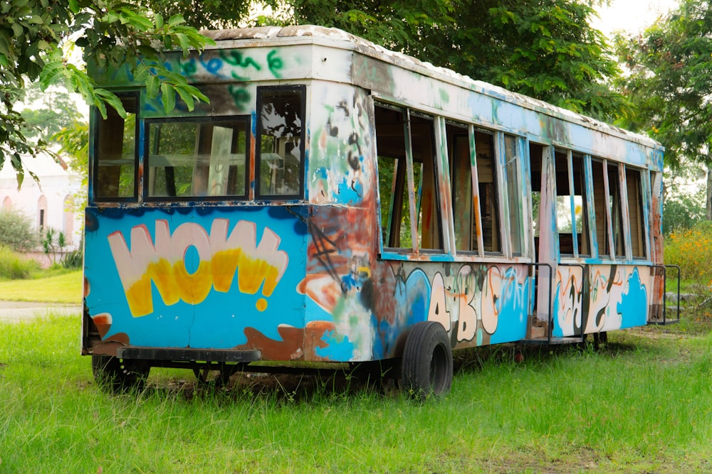 an old bus that has been vandalized with graffiti