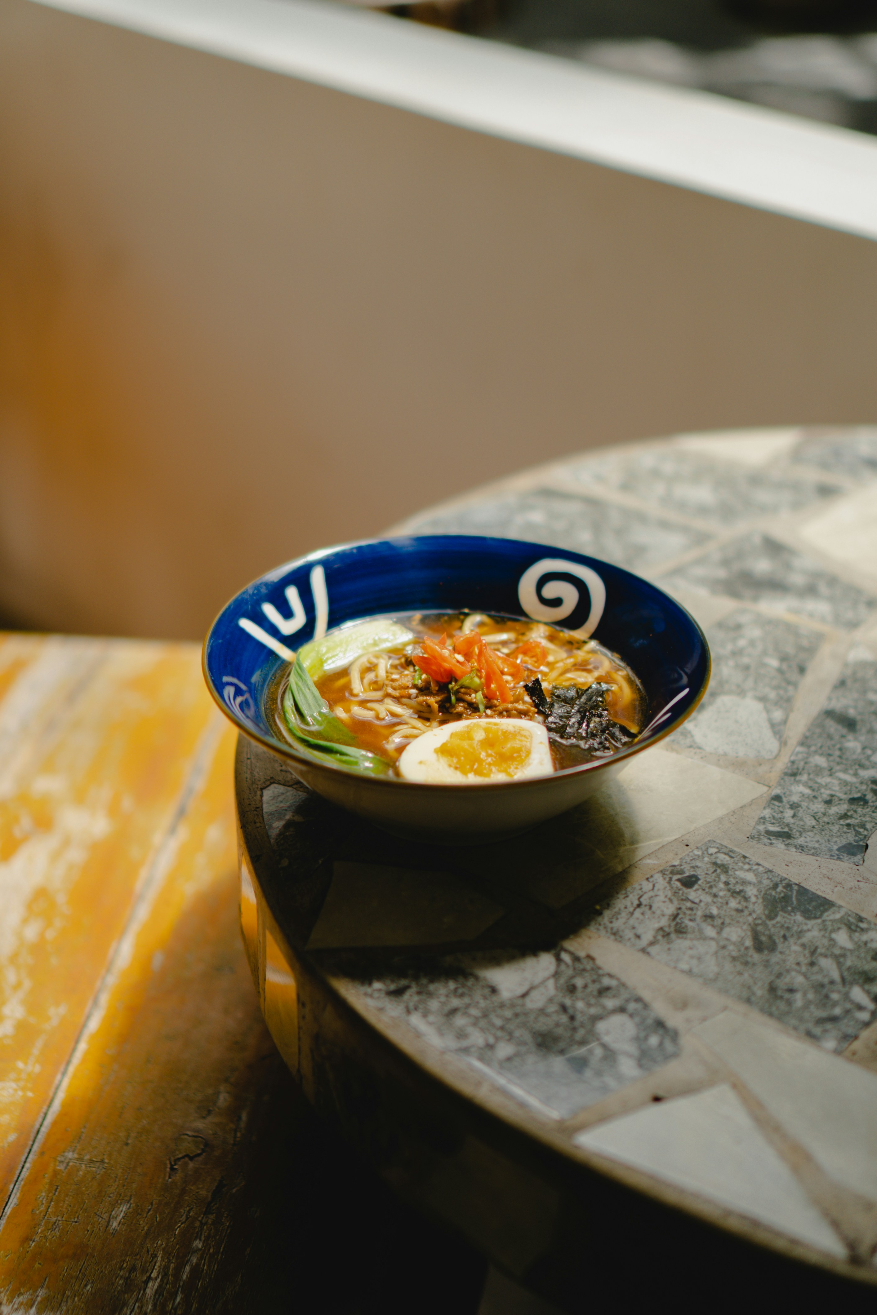 a bowl of soup on a table in a restaurant