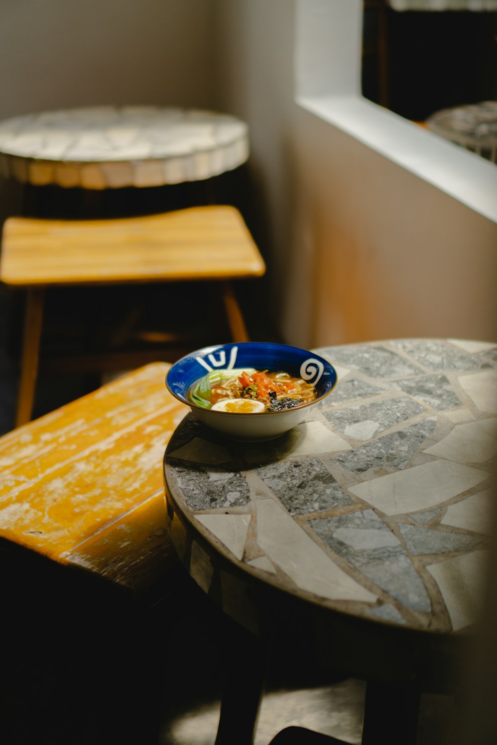 a bowl of food sitting on top of a table